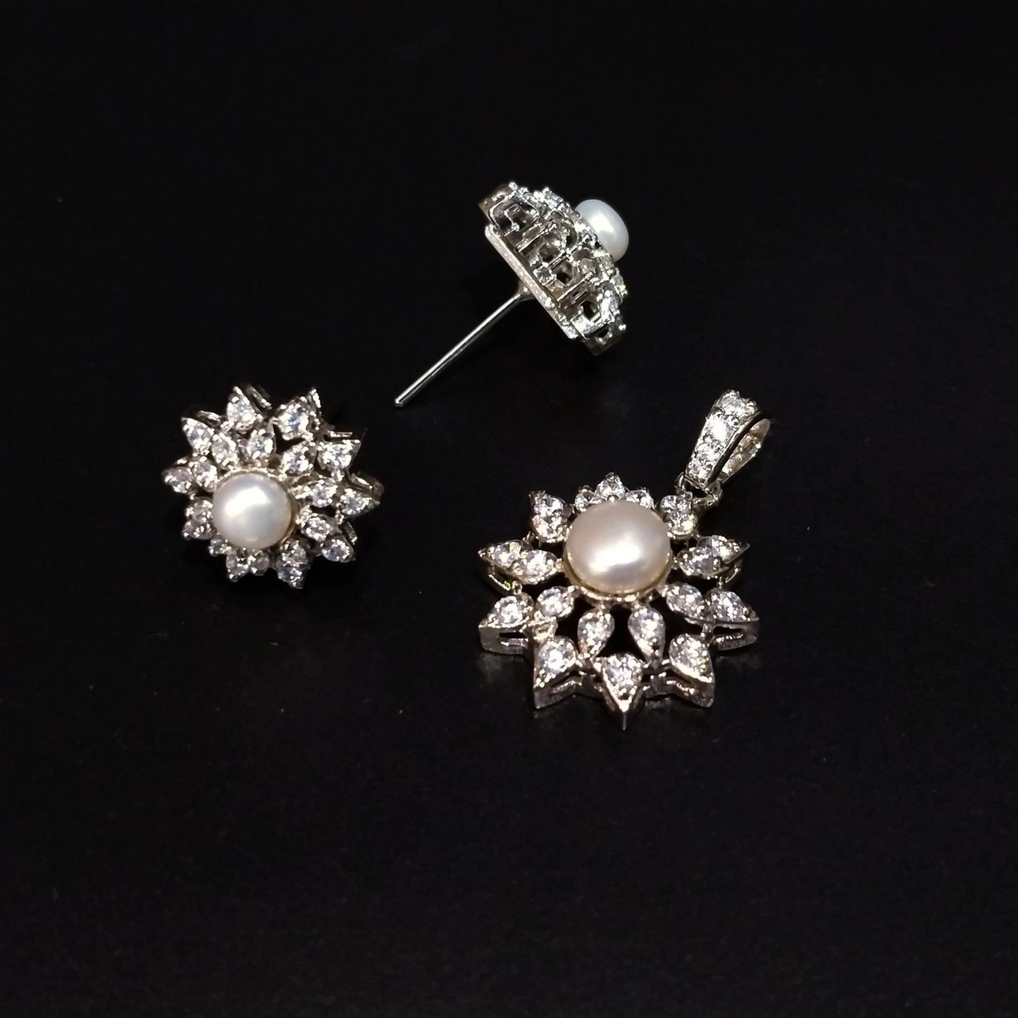 925 Silver Rhodium plated locket set with real pearls.