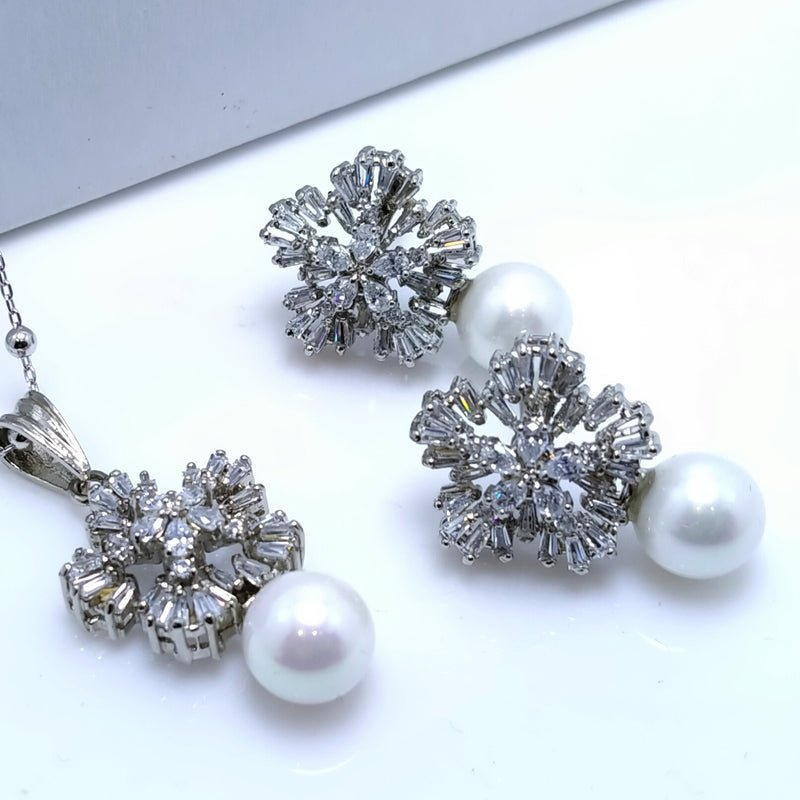 Pendant set With Tapered cut zircons & Pearls White Gold plated.