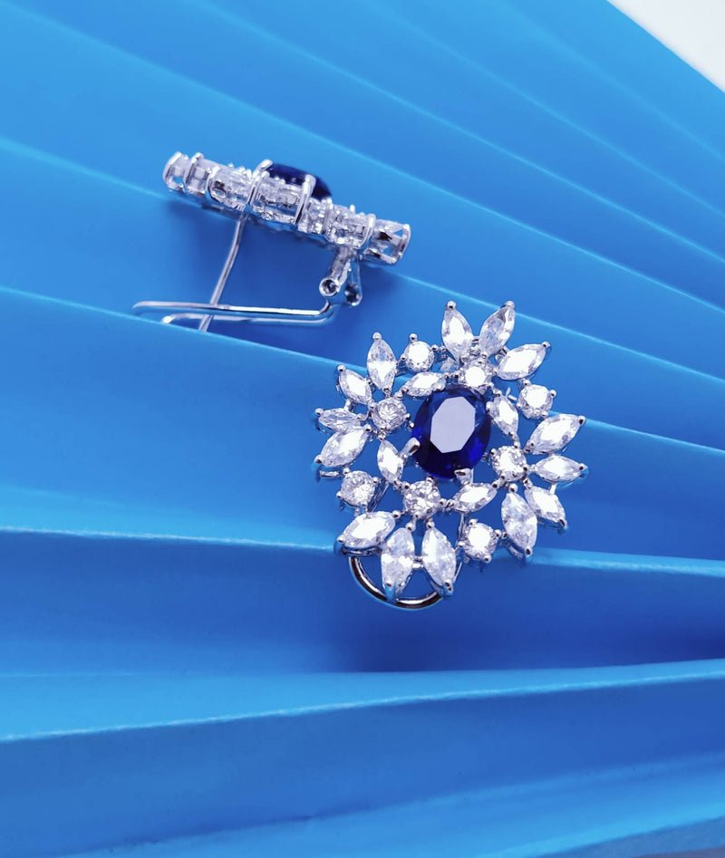 Rhodium Plated Pendant set with Blue Sapphire and Zircons.(925 Silver)