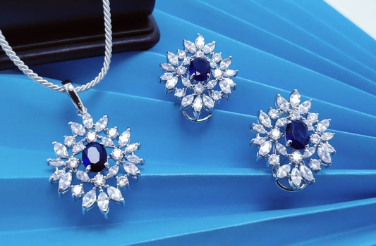 Rhodium Plated Pendant set with Blue Sapphire and Zircons.(925 Silver)